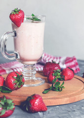 strawberry smoothie with mint on the table, front view