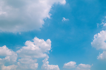 Deep blue sky and white cloud background.