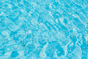 Water surface in blue swimming pool