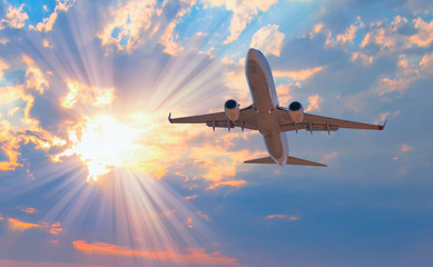 Commerical airplane in the sky at sunrise