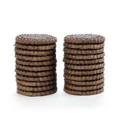 Two stacks of chocolate chip cookies. Close up. Isolated on white background