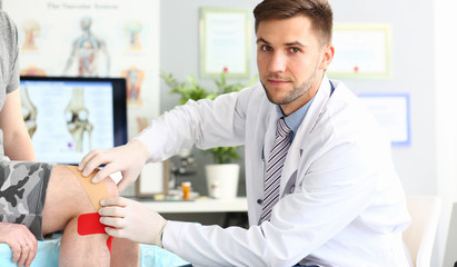 Serious traumatologist at workplace