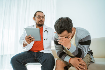 sad patient consultation with doctor try to comfort him of the bad news