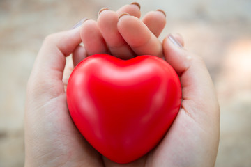 Woman hold red heart