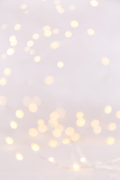 White background with bokeh lights. Holiday Christmas and New Year background. Vertical