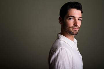 Obraz premium Portrait of young handsome businessman with stubble beard