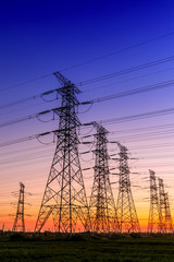 Fototapeta premium High voltage electricity tower sky sunset landscape,industrial background.