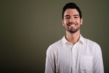 Obraz premium Portrait of young handsome businessman with stubble beard