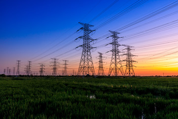 High voltage electricity tower sky sunset landscape,industrial background.