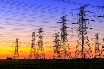 High voltage electricity tower sky sunset landscape,industrial background.