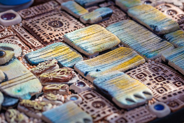 Clay Jewelry. texture of clay ethno products. Ethnic Jewelry made of clay.