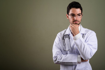 Obraz premium Portrait of young handsome man doctor with eyeglasses