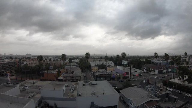 Float towards South Los Angeles on Cloudy Day above Sunset Boulevard in Hollywood, California