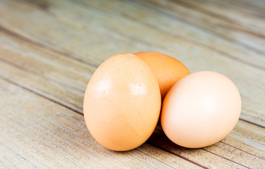 Three Eggs up close on a wooden background