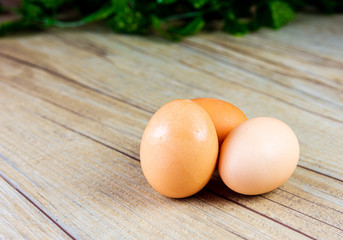 Three Eggs up close on a wooden background