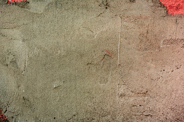 Texture of a concrete wall with cracks and scratches which can be used as a background