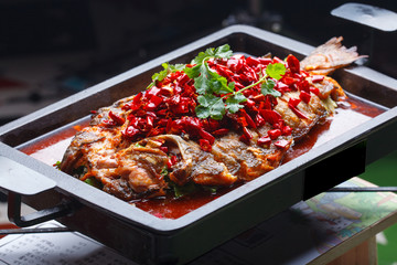 A plate of grilled fish, sichuan cuisine