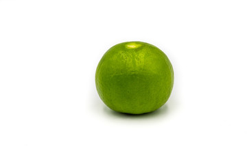 Fresh green lemon on white background