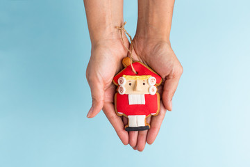 toy nutcracker in hand on a blue background