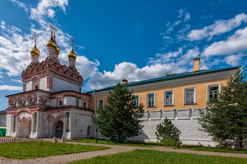 Fototapeta na wymiar There is a magnificent church above the gates of the monastery. Russian shrines. Joseph-Volotsky Monastery in Teryaev. Moscow region, Teryaevo.