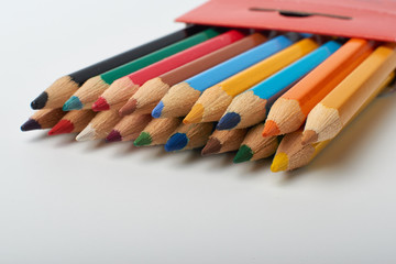 Color pencils on white background, copy space