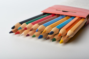 Obraz premium Color pencils on white background, copy space