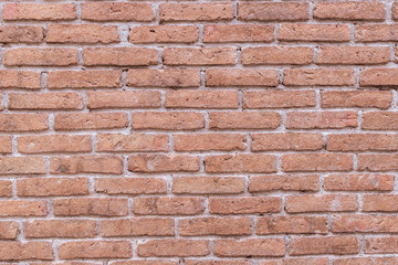 Old grungy red brick wall block pattern and cement surface background.Vintage wallpaper.Rustic stonewall.Brickwork.