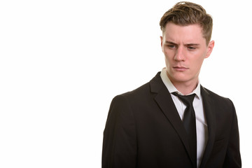 Face of young handsome blonde businessman in suit