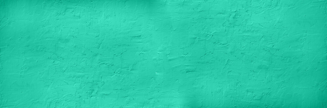 Abstract cement concrete background. Grunge texture, wallpaper. Trendy mint green and turquoise color. Top view, copy space. Banner