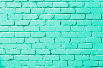 Mint brick wall texture. Background with copy space for design. Trendy green and turquoise color.