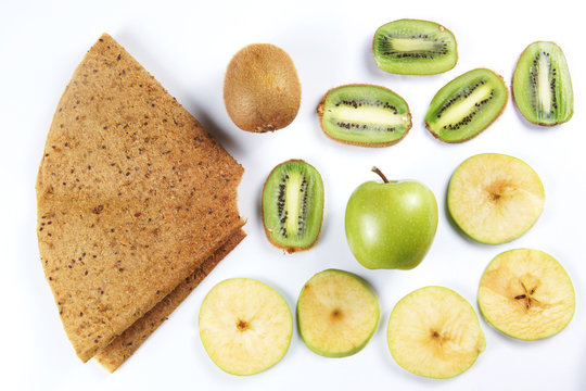 Ingredients for fruit pastille made of kiwis and apples on white background. Healthy vegetarian dietary food