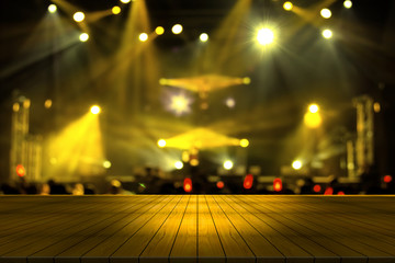 top desk with light bokeh in concert blur background,wooden table,Yellow color tone