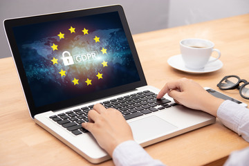 people using computer laptop with text GDPR or General Data Protection Regulation secure , star and padlock logo on monitor screen. cyber security and privacy concept.
