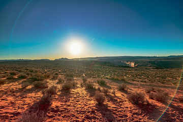 Sun setting in the desert on the hike to Horseshoe Bend in Page, Arizona, USA. - Powered by Adobe