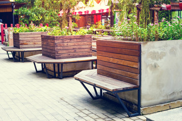 Brown wooden bench in the garden,Vintage tone