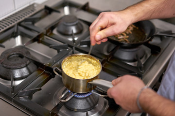The chef cook the dish Pumpkin Risotto with with duck and parmesan cheese mousse. Seasonal autumnal recipe - risotto with organic pumpkins.
