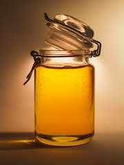 Flower honey in a transparent jar