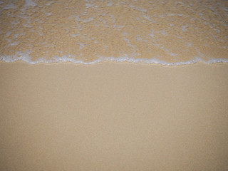 Fototapeta na wymiar Wave impact on beach