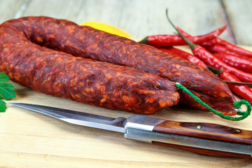 whole chorizo on a cutting board