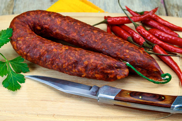 whole chorizo on a cutting board