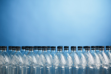 empty plastic bottles on blue background