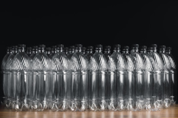 empty plastic bottles on black background