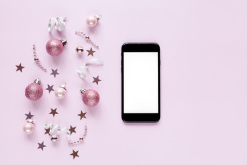 Pink christmas background with christmas balls and other decoration and accessories. Flat lay. Christmas mock-up
