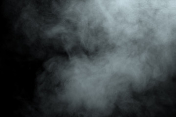 Abstract  powder or smoke isolated on black background
