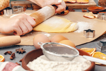 Fototapeta na wymiar Close up of Woman's hands preparing dough for cookies