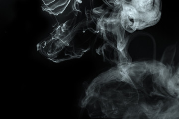 Abstract  powder or smoke isolated on black background