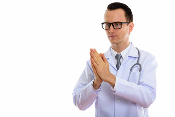 Portrait of young handsome man doctor with eyeglasses