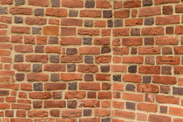 Fototapeta premium Old red brick fortress wall with gray cement mortar textute