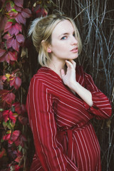 young beautiful pregnant woman in a red dress