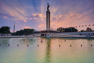 Fototapeta na wymiar West Irian Liberation Monument in Jakarta in the sunset with ray of light, Jakarta, Indonesia